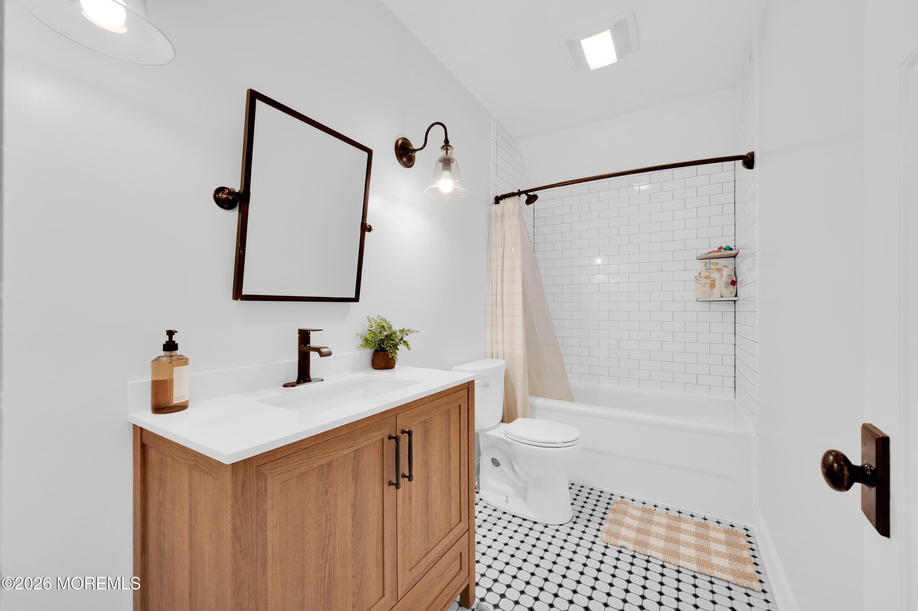 203 Riviera Drive Toms River, NJ 08753 - Photo 26 of 37 a bathroom with a sink a toilet and shower