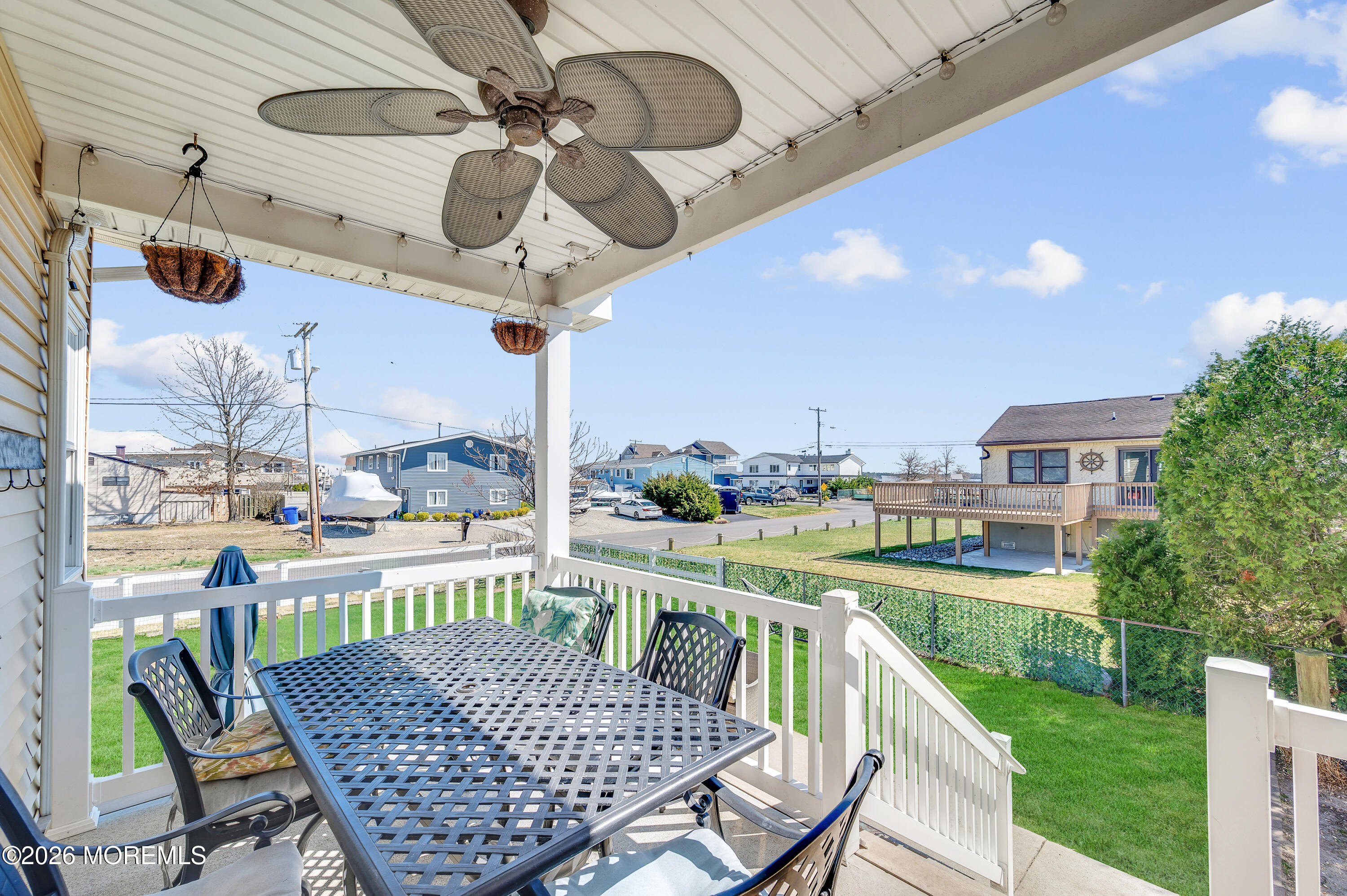 203 Riviera Drive Toms River, NJ 08753 - Photo 31 of 37 a view of a patio with a table chairs and a table