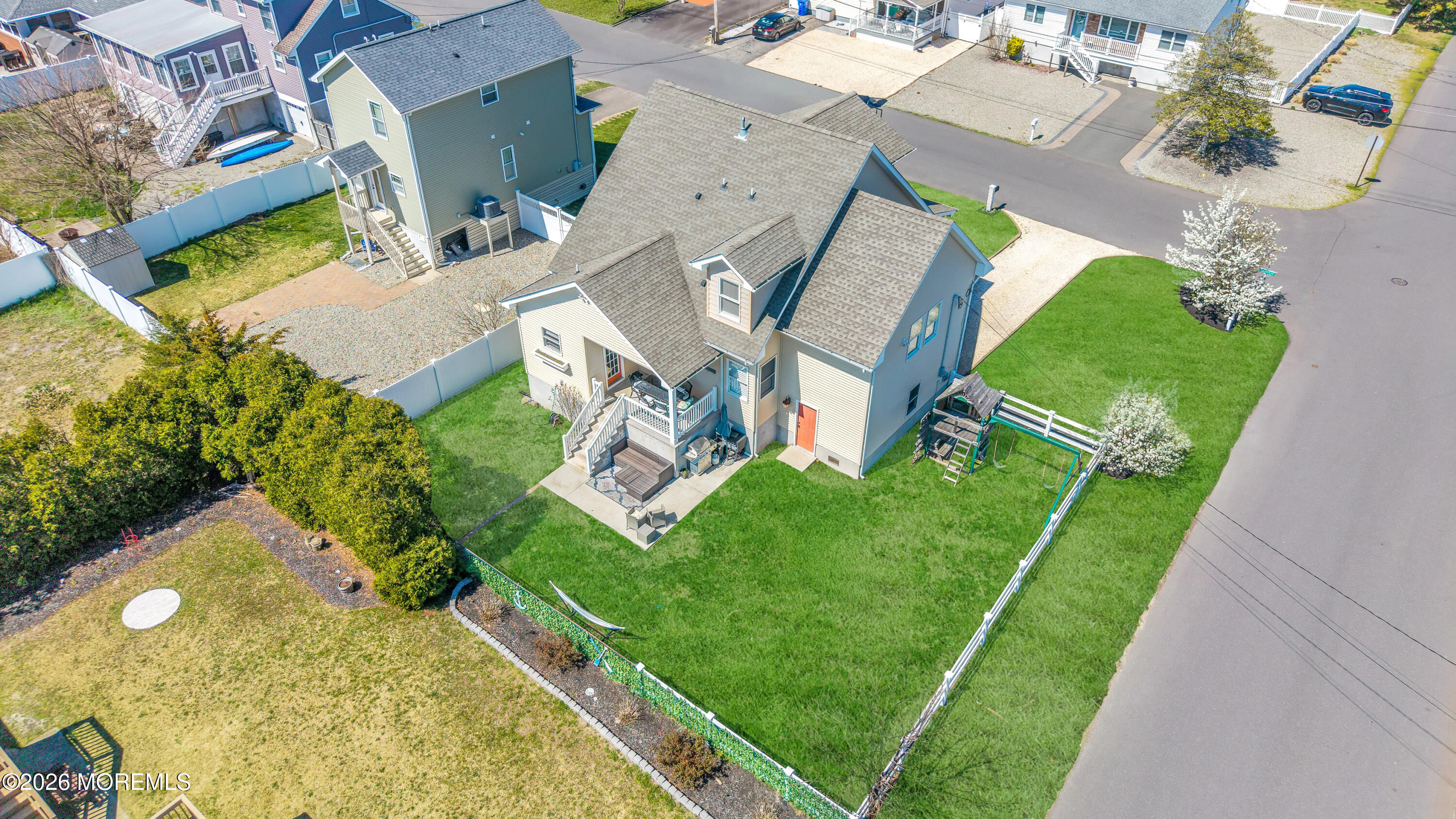 203 Riviera Drive Toms River, NJ 08753 - Photo 34 of 37 an aerial view of a house with a garden and trees