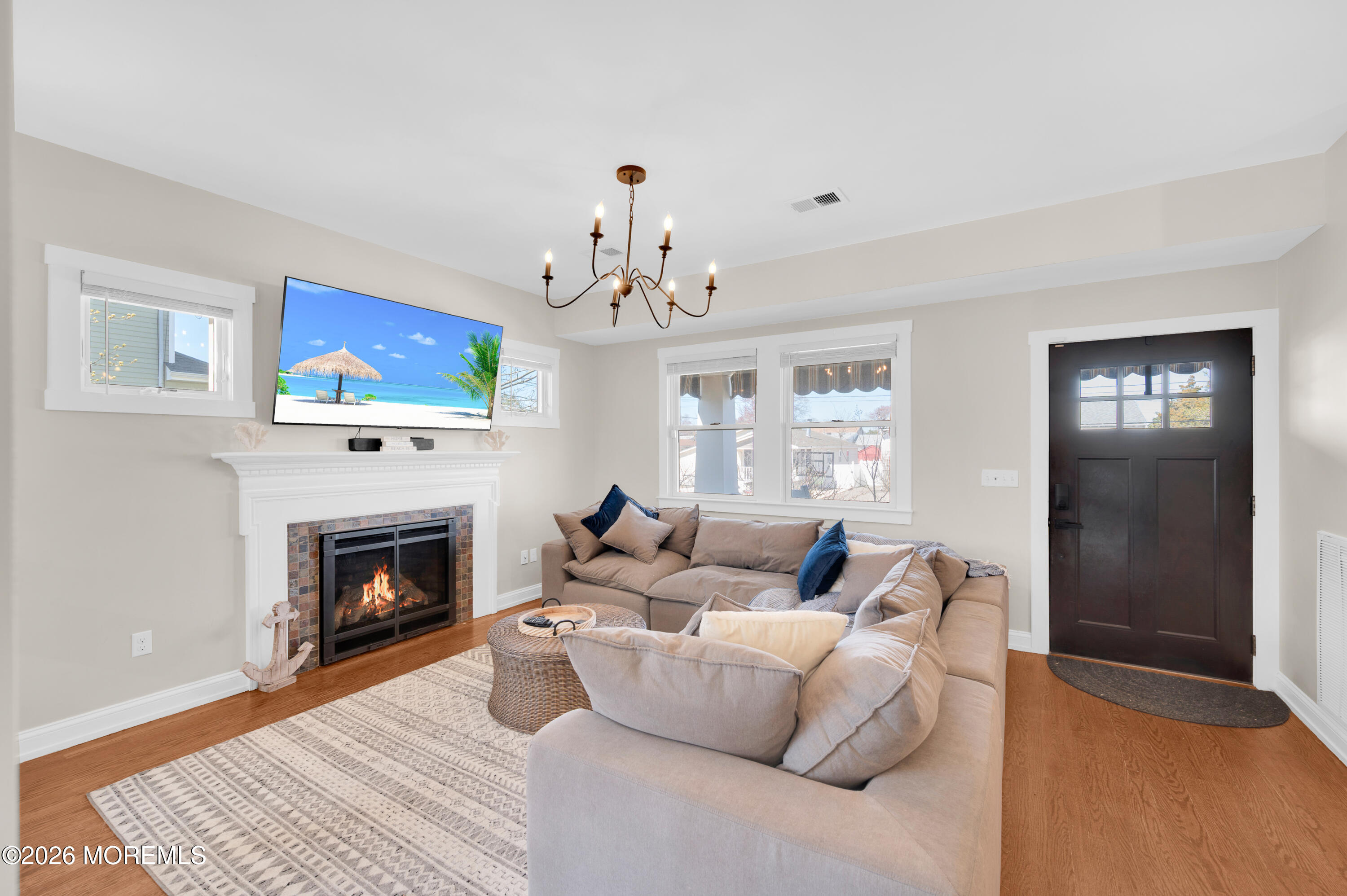 203 Riviera Drive Toms River, NJ 08753 - Photo 5 of 37 a living room with furniture a fireplace and a rug