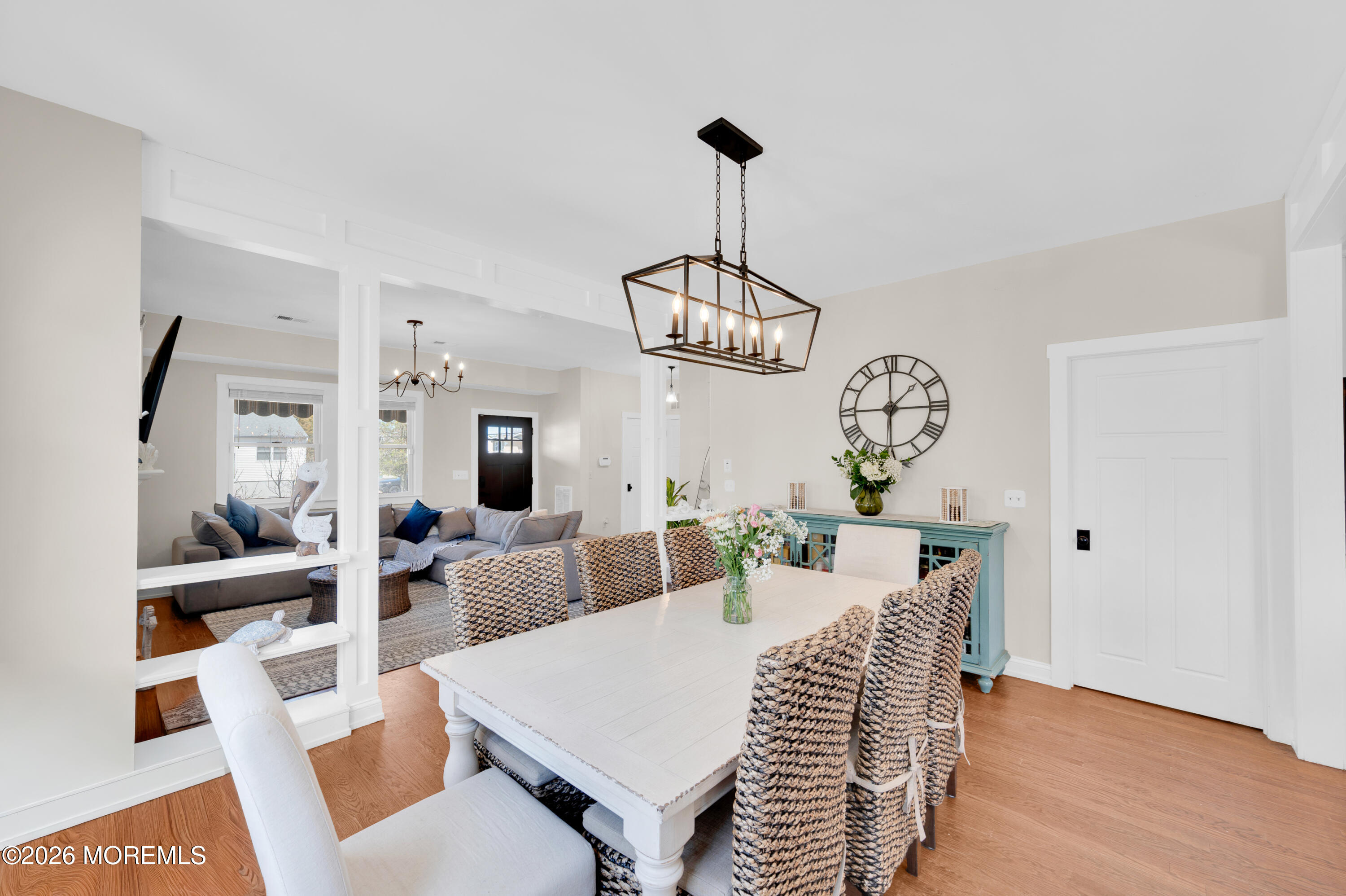 203 Riviera Drive Toms River, NJ 08753 - Photo 10 of 37 a view of a dining room with furniture a chandelier and wooden floor