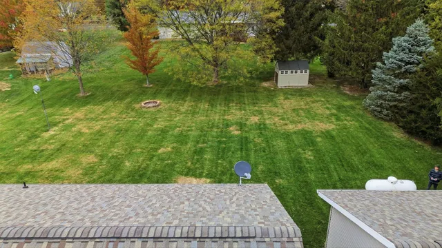 a backyard of a house with lots of green space