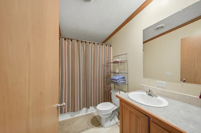 a kitchen with a sink appliances cabinets and a counter top space