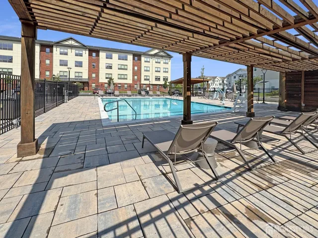 a outdoor view of a house with lounge chair