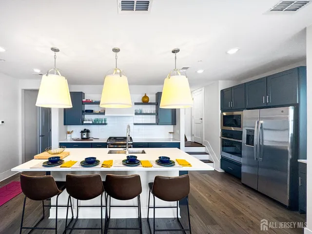 a view of kitchen with dining table and chairs