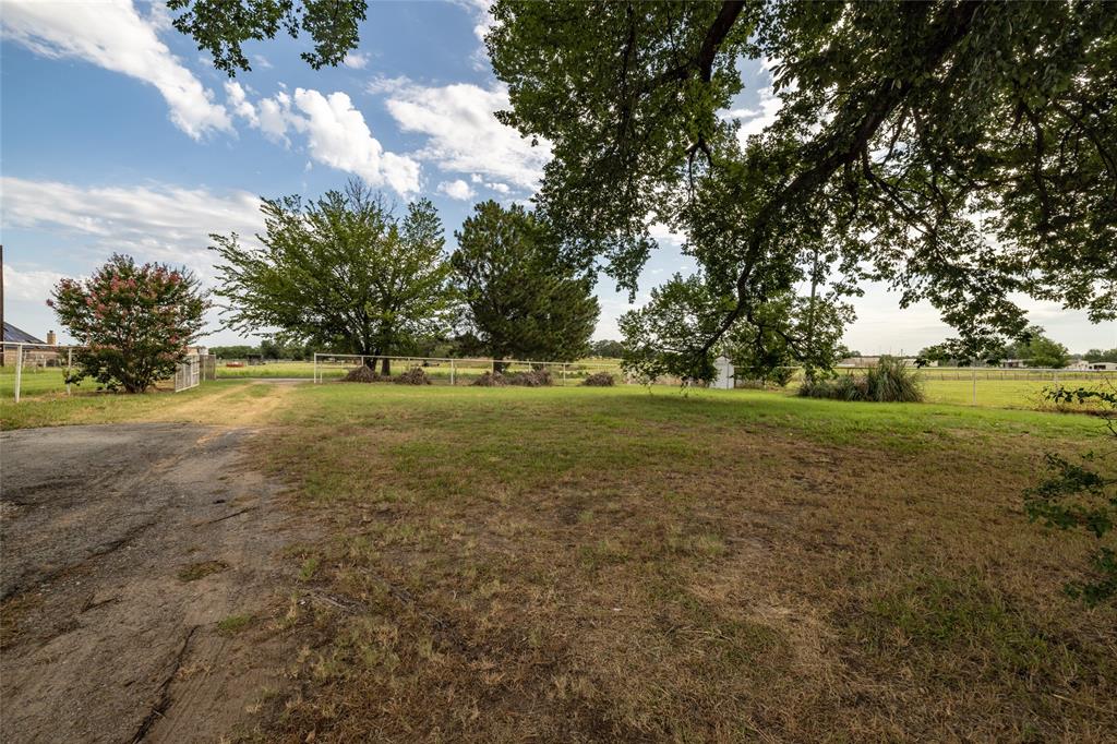 207 Lazy B Lane Springtown, TX 76082 - Photo 39 of 39 View of yard featuring a rural view