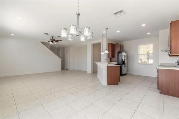 a view of a kitchen with microwave and stove