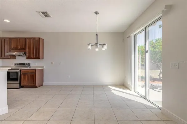 a dining room with furniture and window
