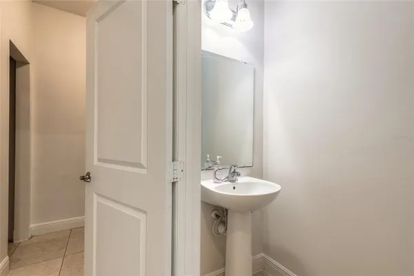 a white toilet sitting next to a small bathroom