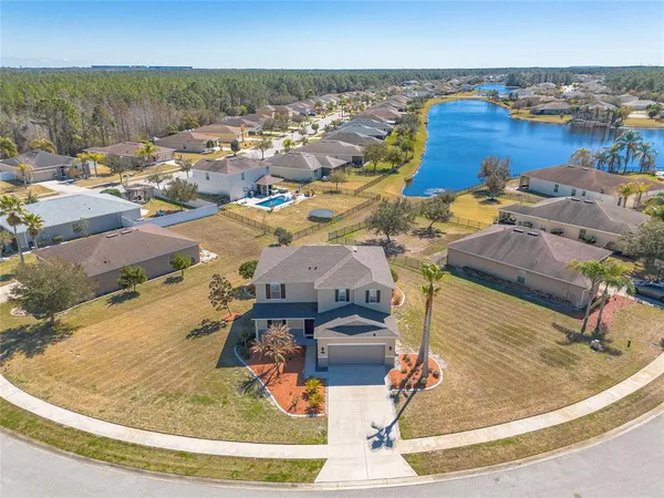 an aerial view of a house with outdoor space