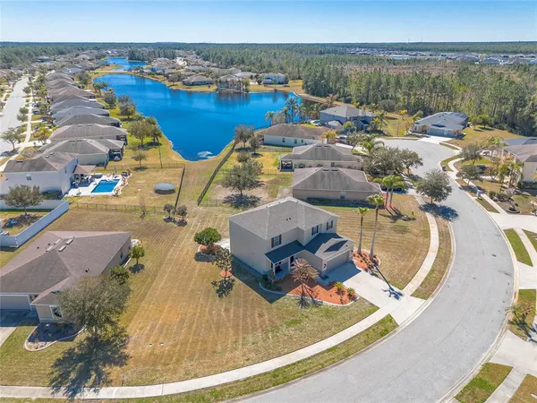 an aerial view of a house with outdoor space