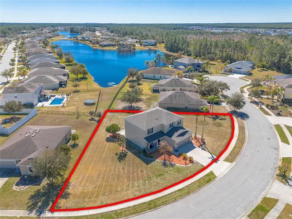 a view of a swimming pool and lounge chair