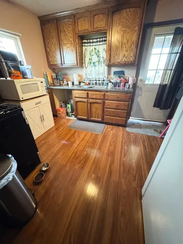 a room with wooden floors and window