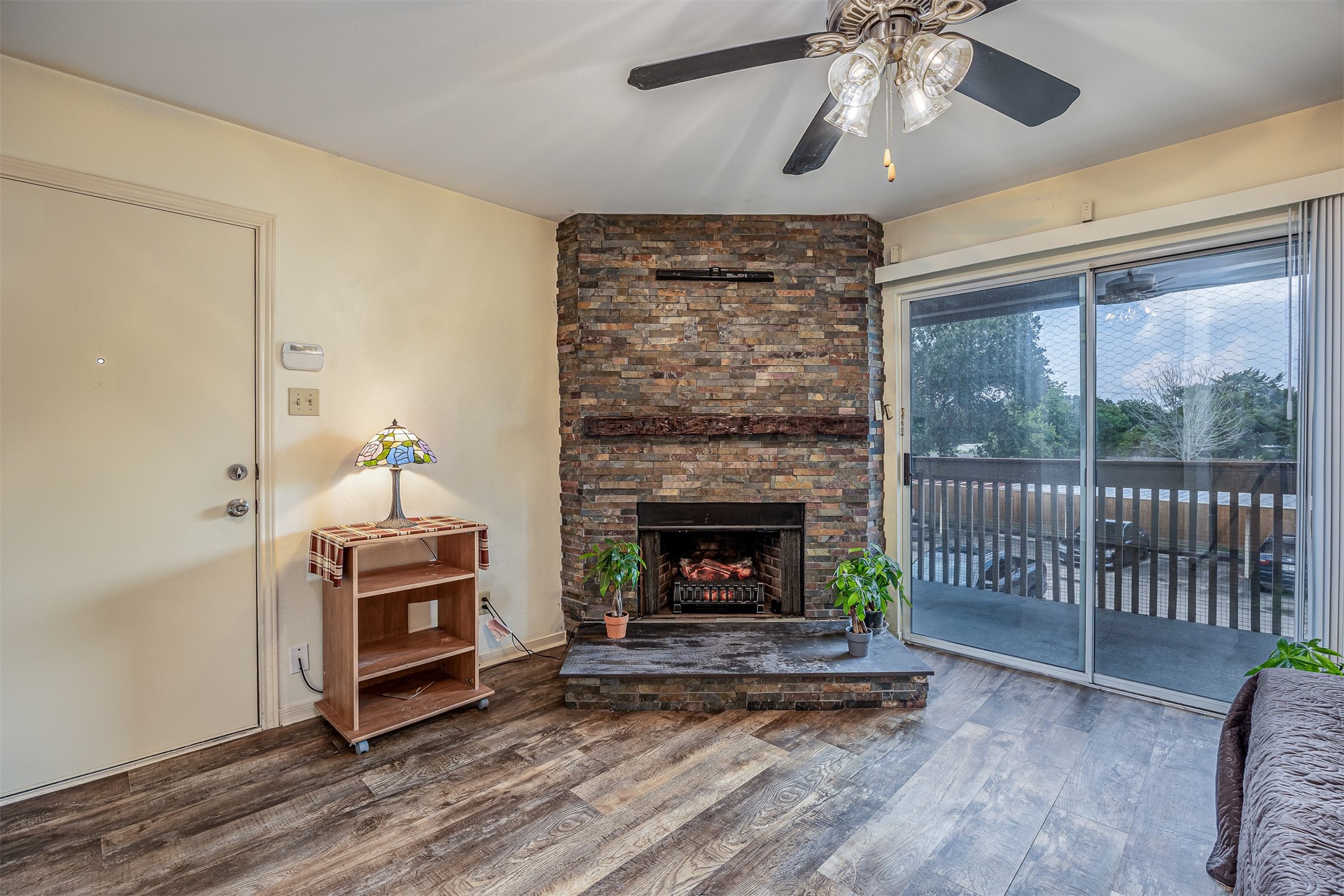 1505 Ward Road, Unit 128 Baytown, TX 77520 - Photo 5 of 21 Cozy wood-burning fireplace with a convenient electric insert.