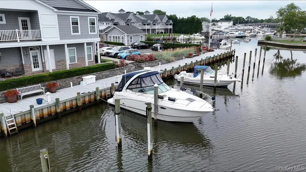a view of house with yard and seating space
