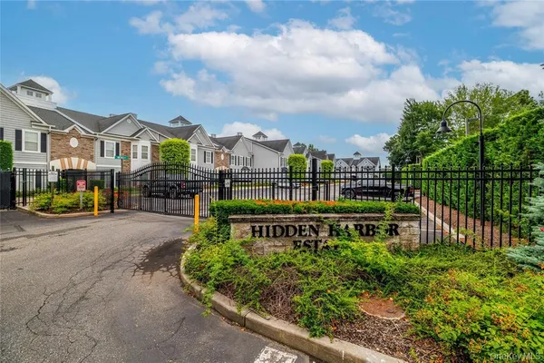 a view of a garden with wooden fence