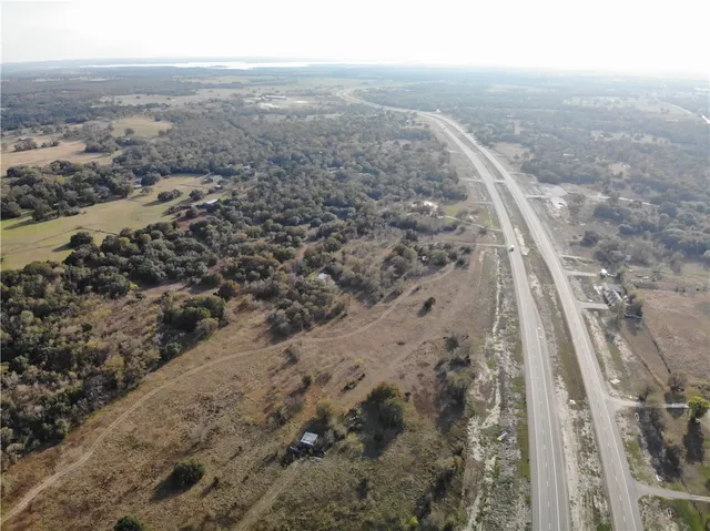 an aerial view of house with yard