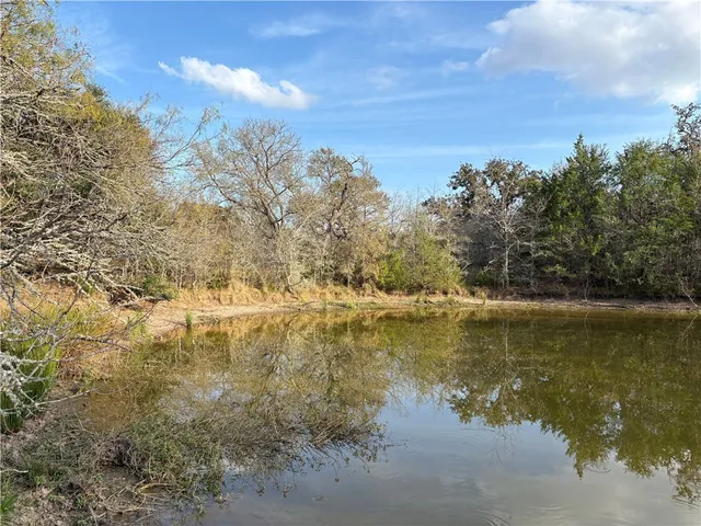 a view of lake with green space
