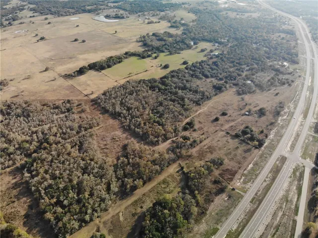 a view of a beach with wooden fence