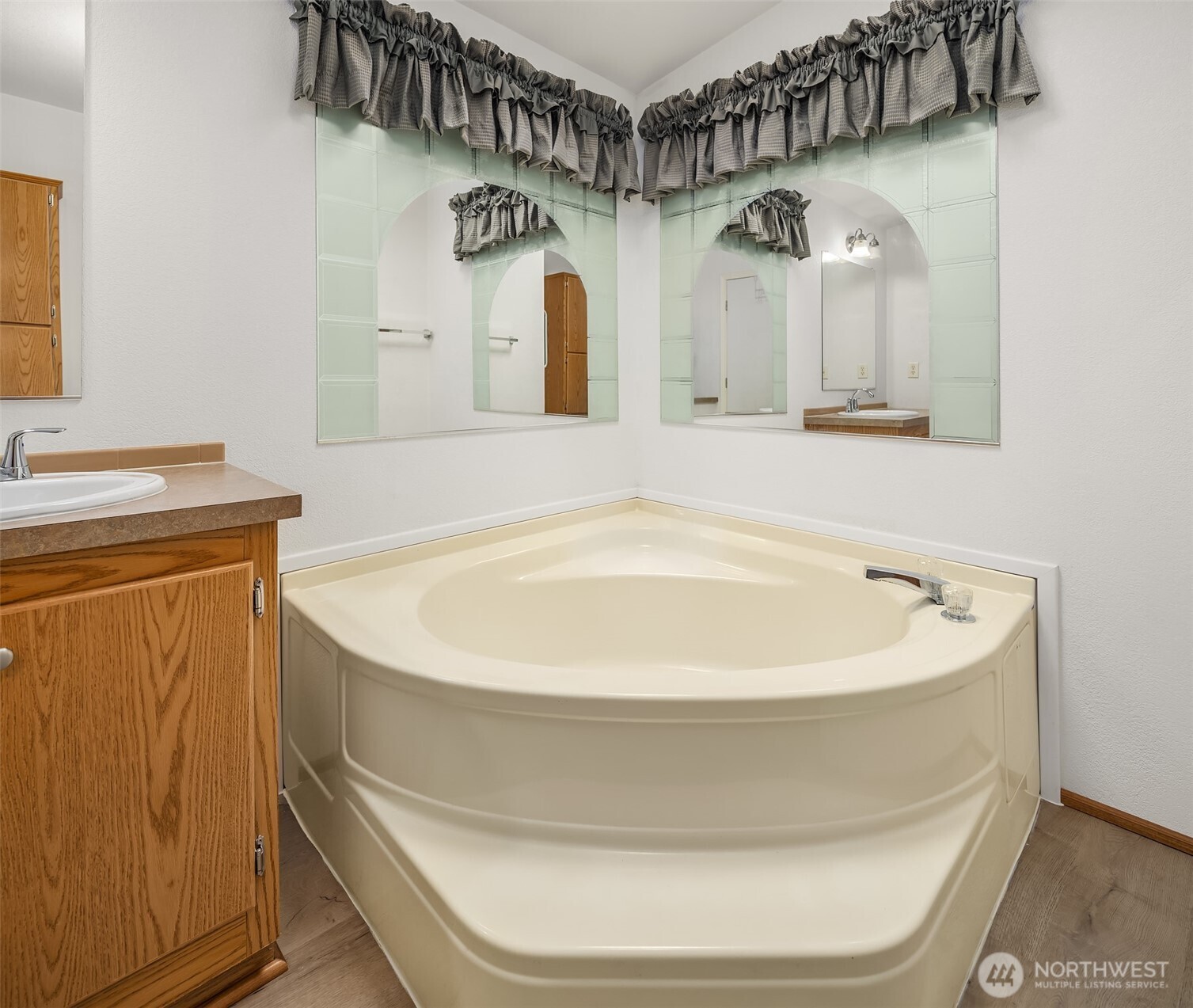 3222 206th Place Southeast Bothell, WA 98012 - Photo 15 of 32 a bathroom with a bathtub and a sink