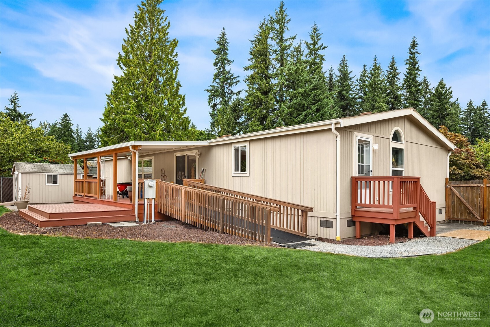 3222 206th Place Southeast Bothell, WA 98012 - Photo 25 of 32 a view of a house with a yard and deck