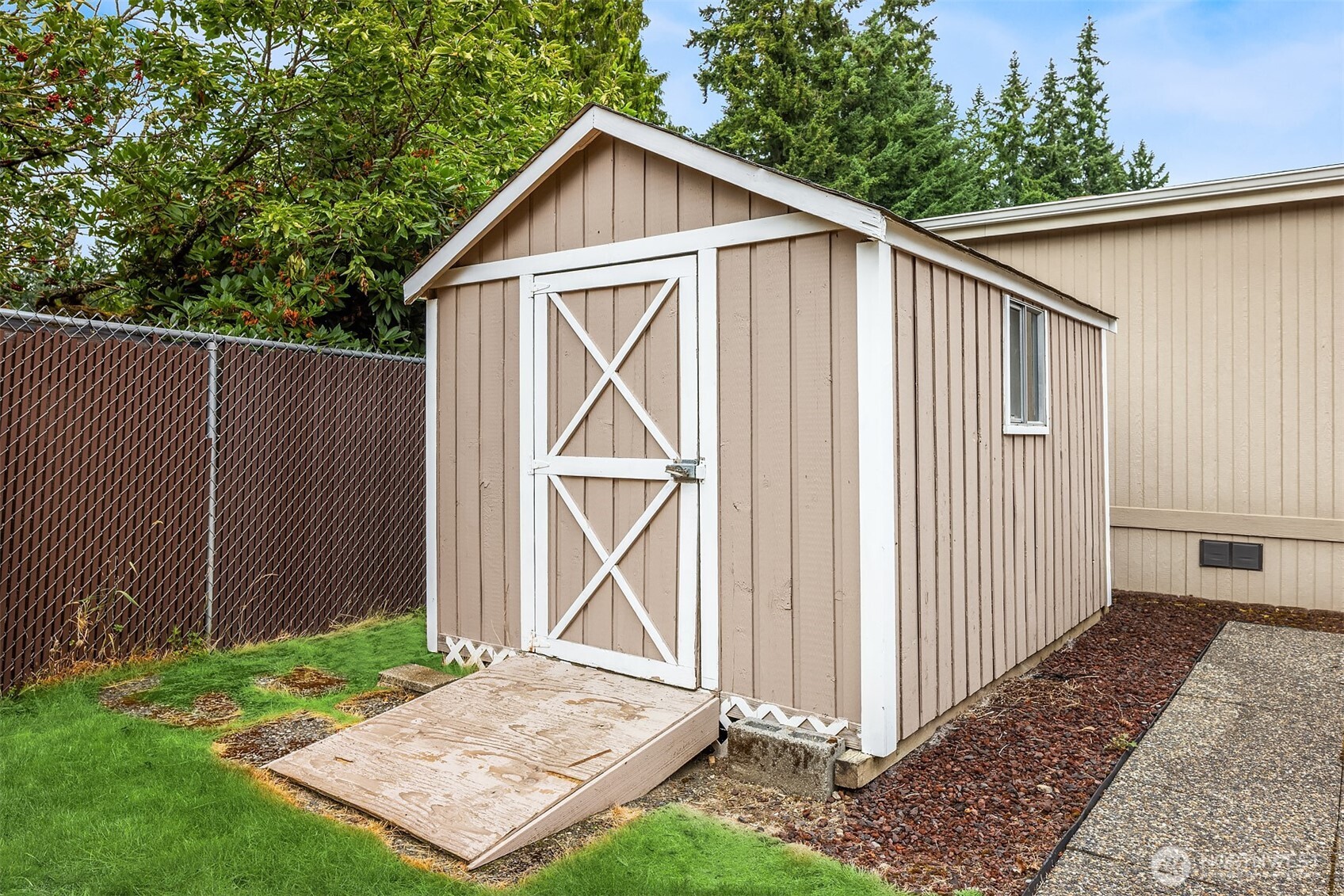 3222 206th Place Southeast Bothell, WA 98012 - Photo 27 of 32 a backyard of a house wit a barn windows