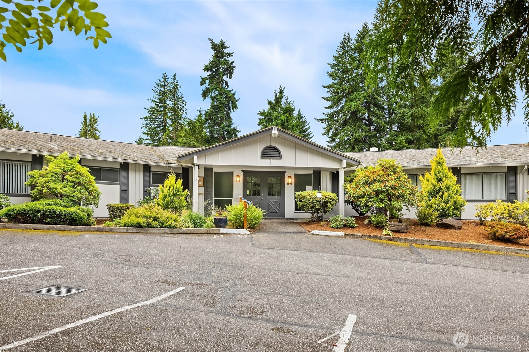 3222 206th Place Southeast Bothell, WA 98012 - Photo 29 of 32 a front view of a house with a yard and potted plants