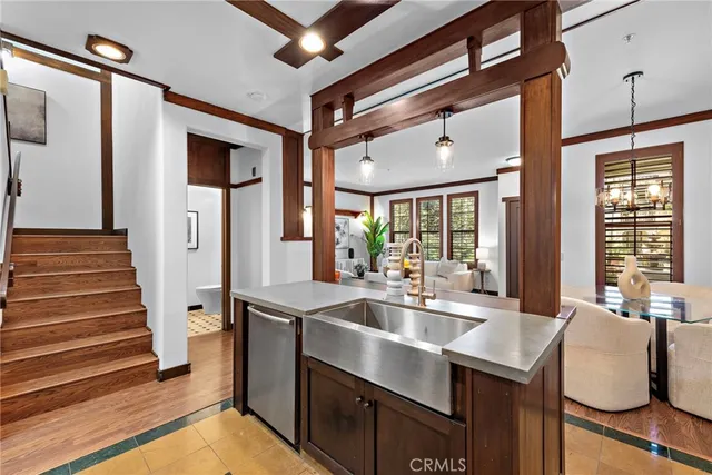 a kitchen with sink and windows