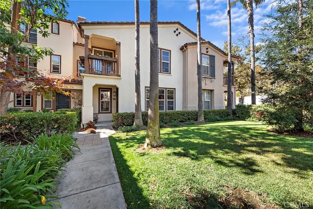 a view of a big yard in front of a brick building