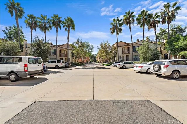 a view of car parked on the side of a street