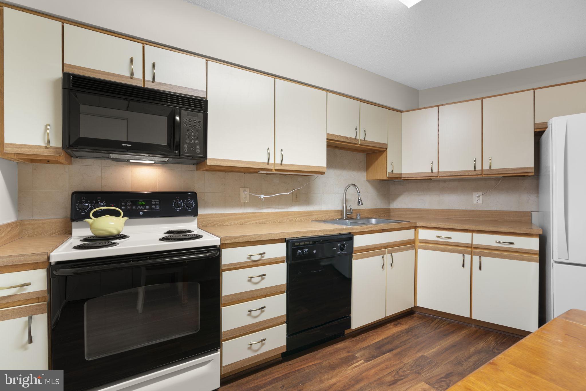 15115 Interlachen Drive, Unit 3204 Silver Spring, MD 20906 - Photo 13 of 50 Modern kitchen with sleek finishes.