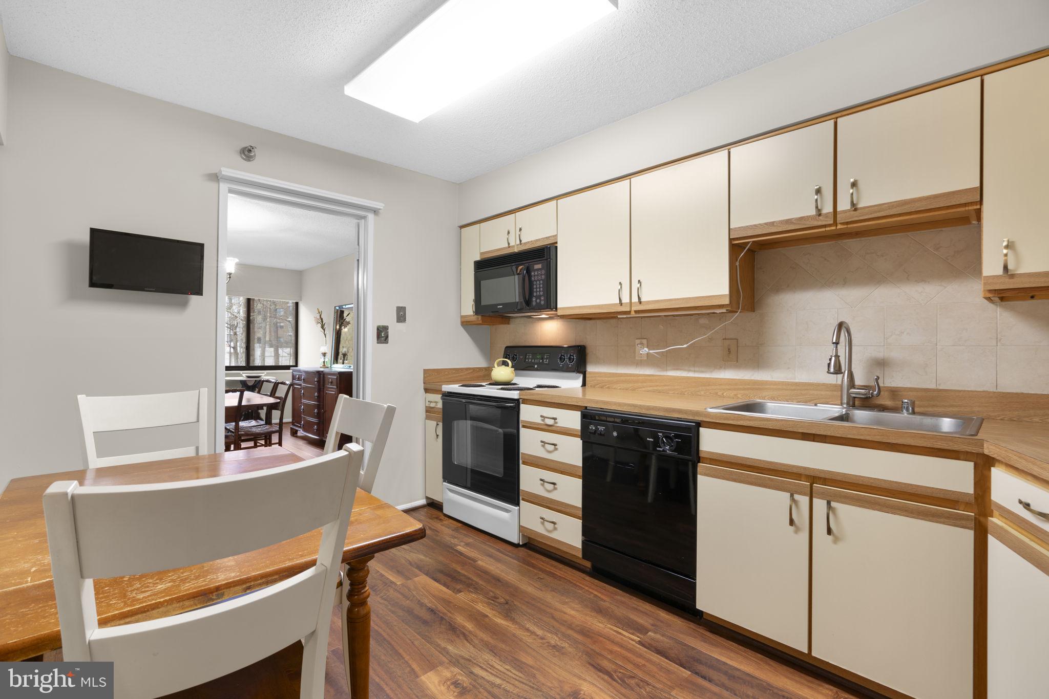 15115 Interlachen Drive, Unit 3204 Silver Spring, MD 20906 - Photo 14 of 50 Cozy kitchen with modern amenities.