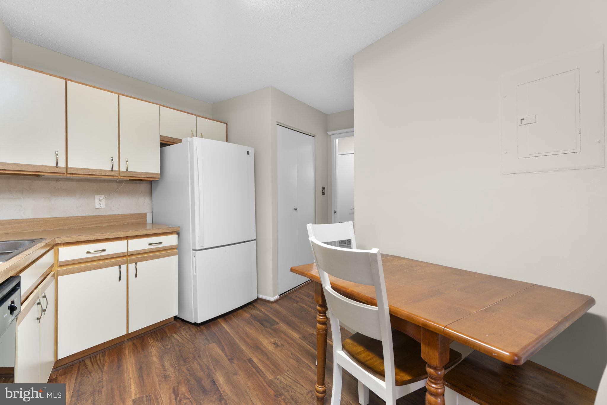 15115 Interlachen Drive, Unit 3204 Silver Spring, MD 20906 - Photo 15 of 50 Cozy kitchen with modern finishes.