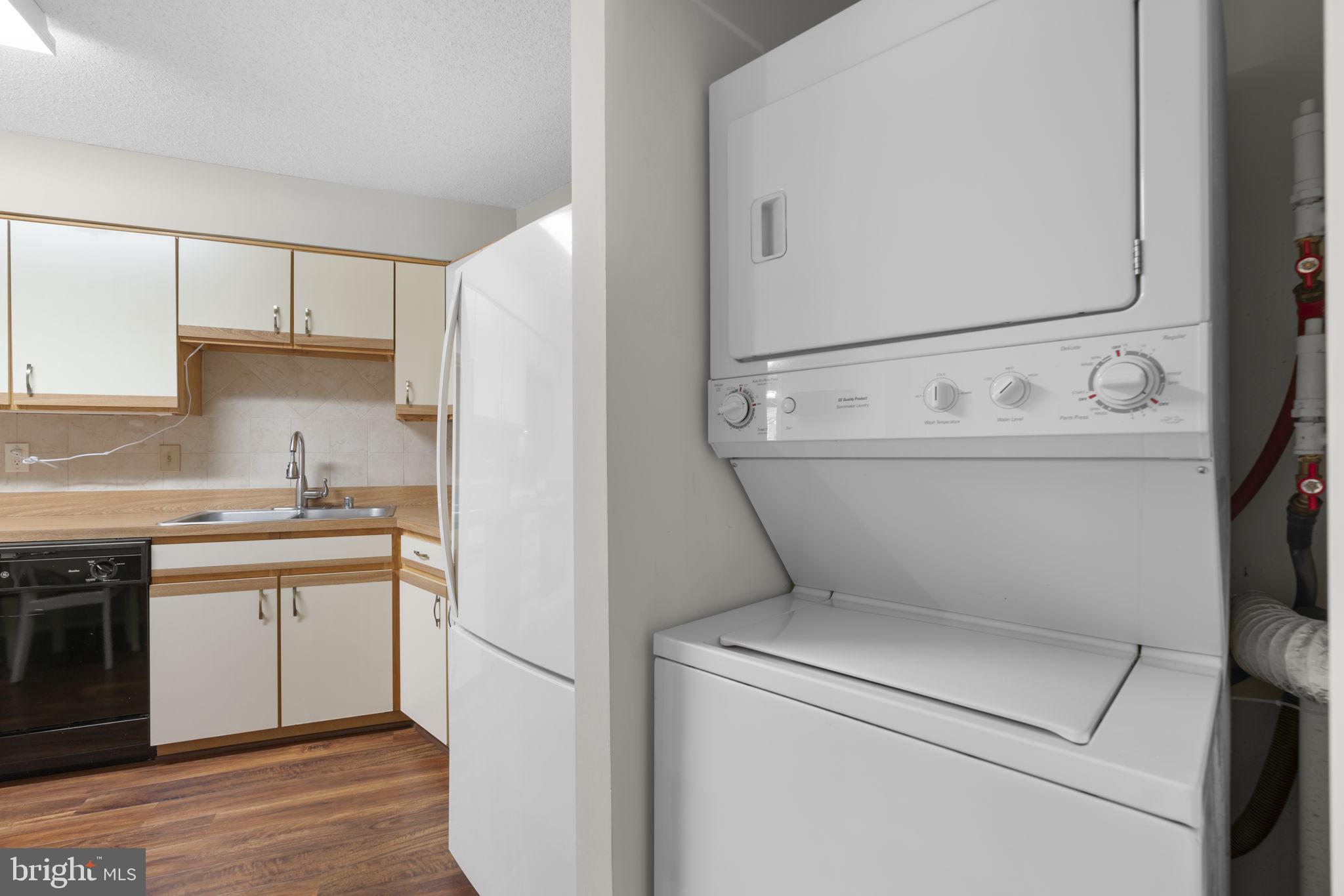 15115 Interlachen Drive, Unit 3204 Silver Spring, MD 20906 - Photo 18 of 50 Modern laundry nook in a cozy kitchen.