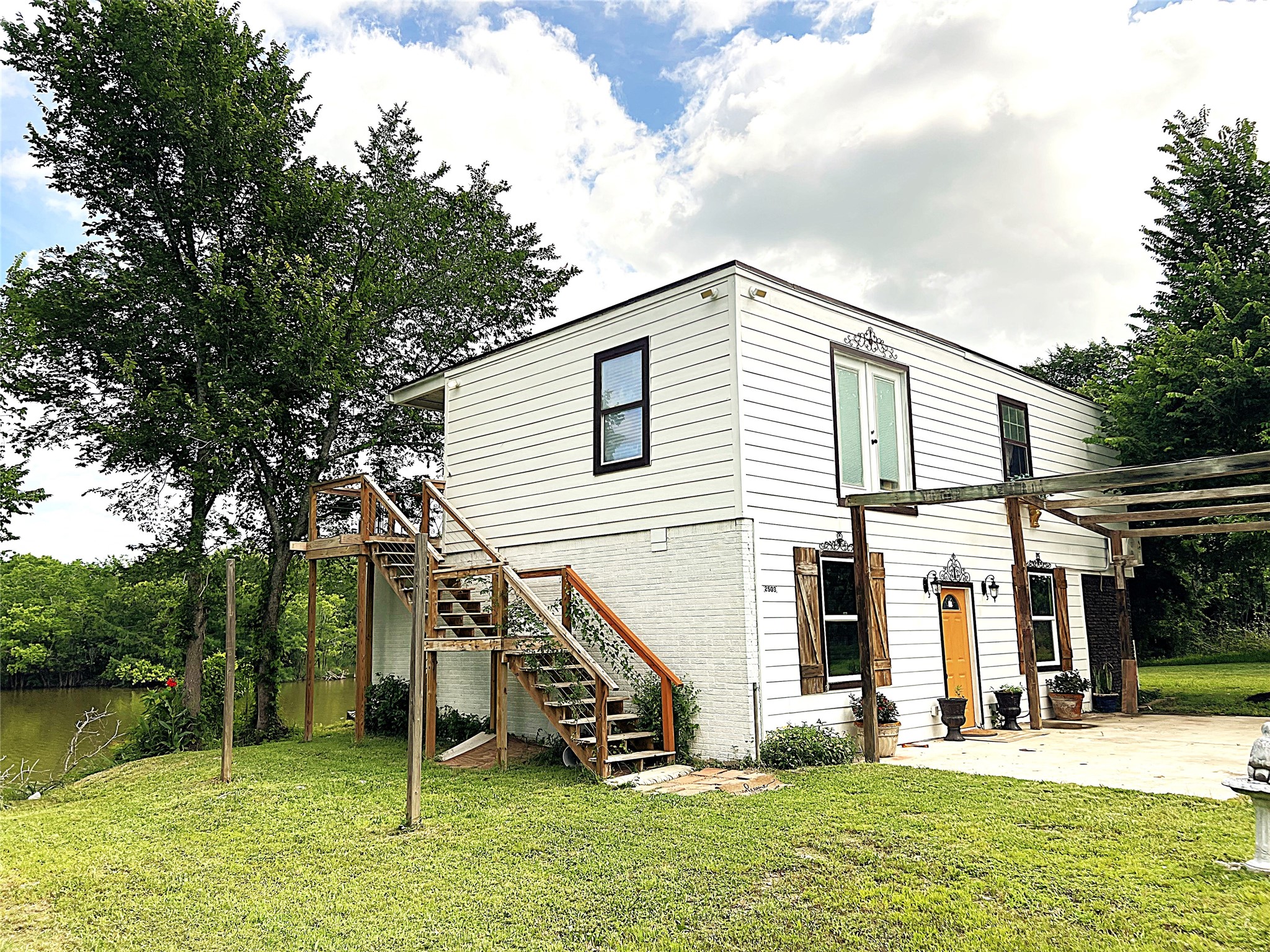 2503 River Crest, Unit 1 Houston, TX 77338 - Photo 3 of 28 a view of a house with a yard