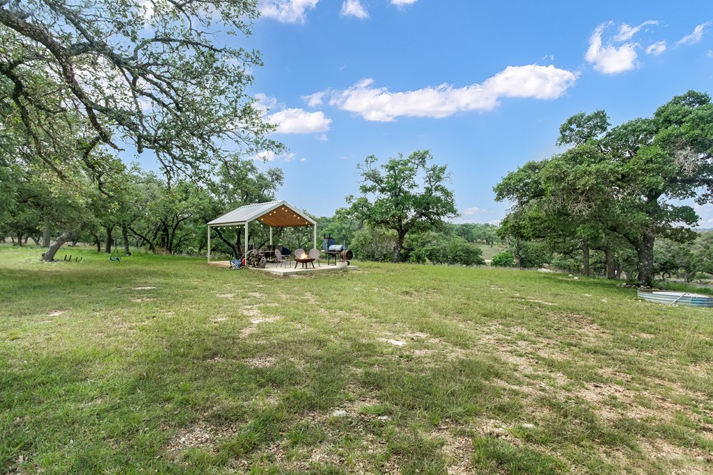 181 Real Lake House Road South Kerrville, TX 78028 - Photo 3 of 18 a view of a house with a yard