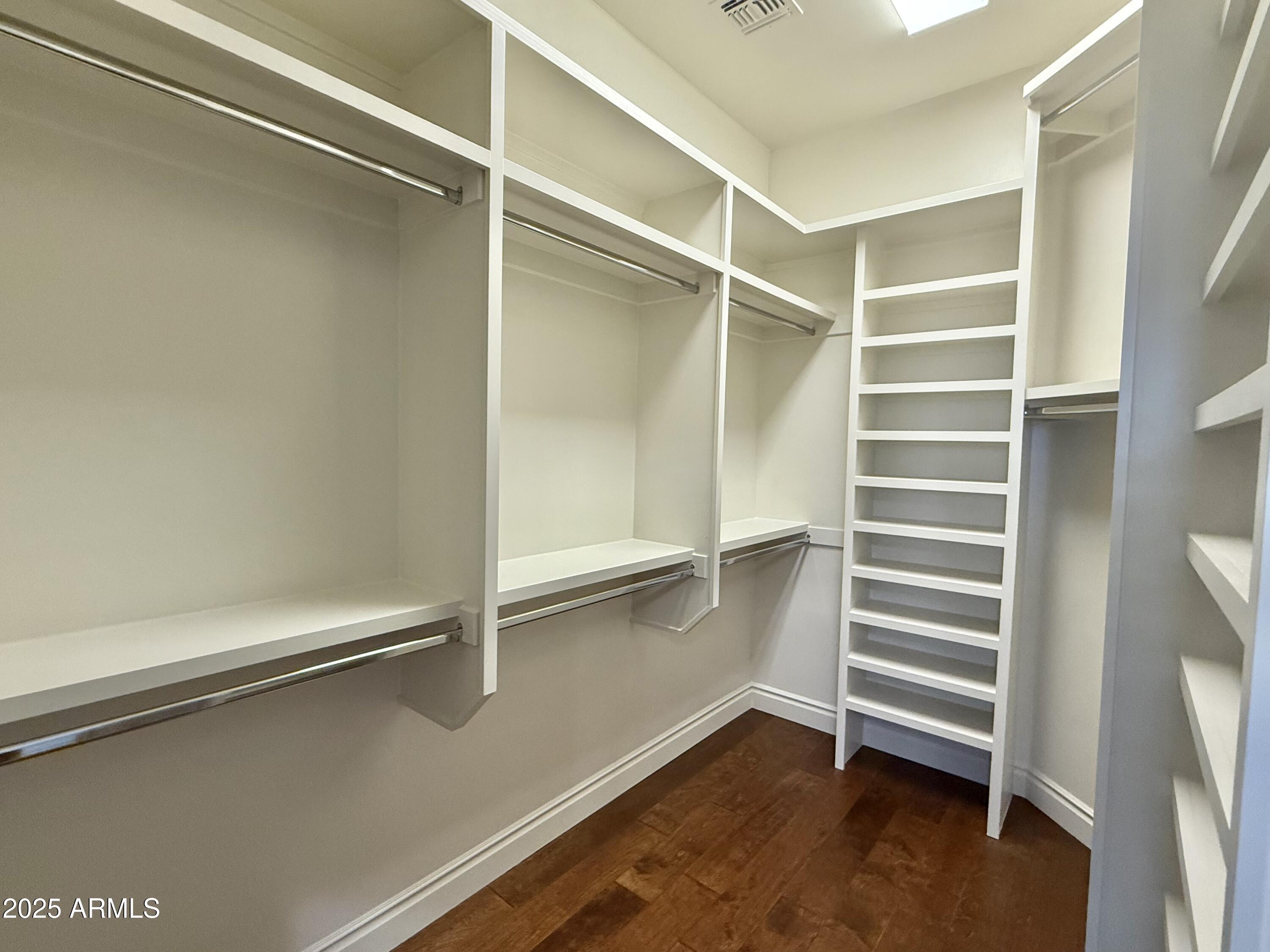 27227 North Miller Road Scottsdale, AZ 85266 - Photo 19 of 31 a view of walk in closet with empty racks