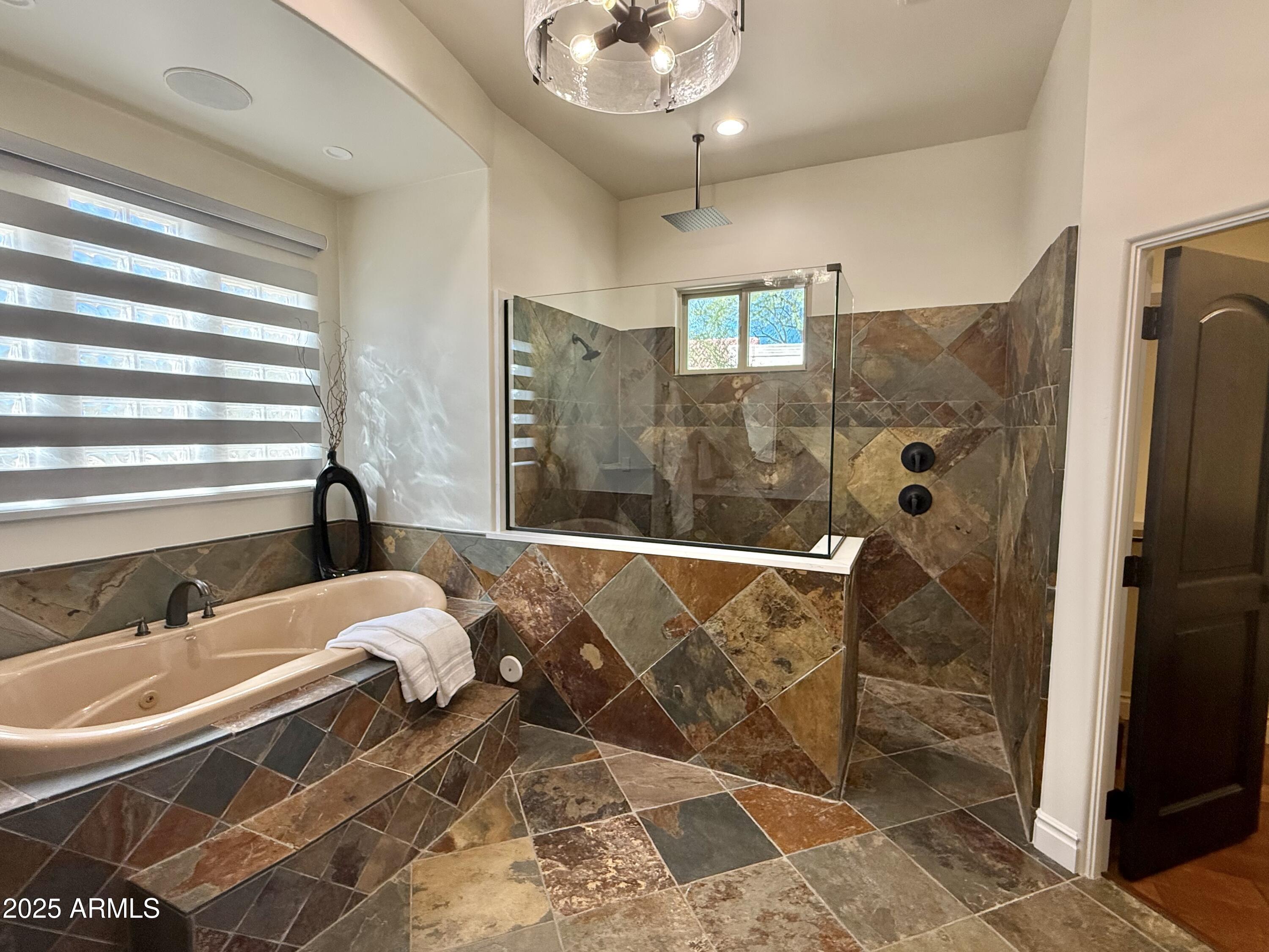 27227 North Miller Road Scottsdale, AZ 85266 - Photo 20 of 31 a bathroom with a granite countertop sink a mirror and shower