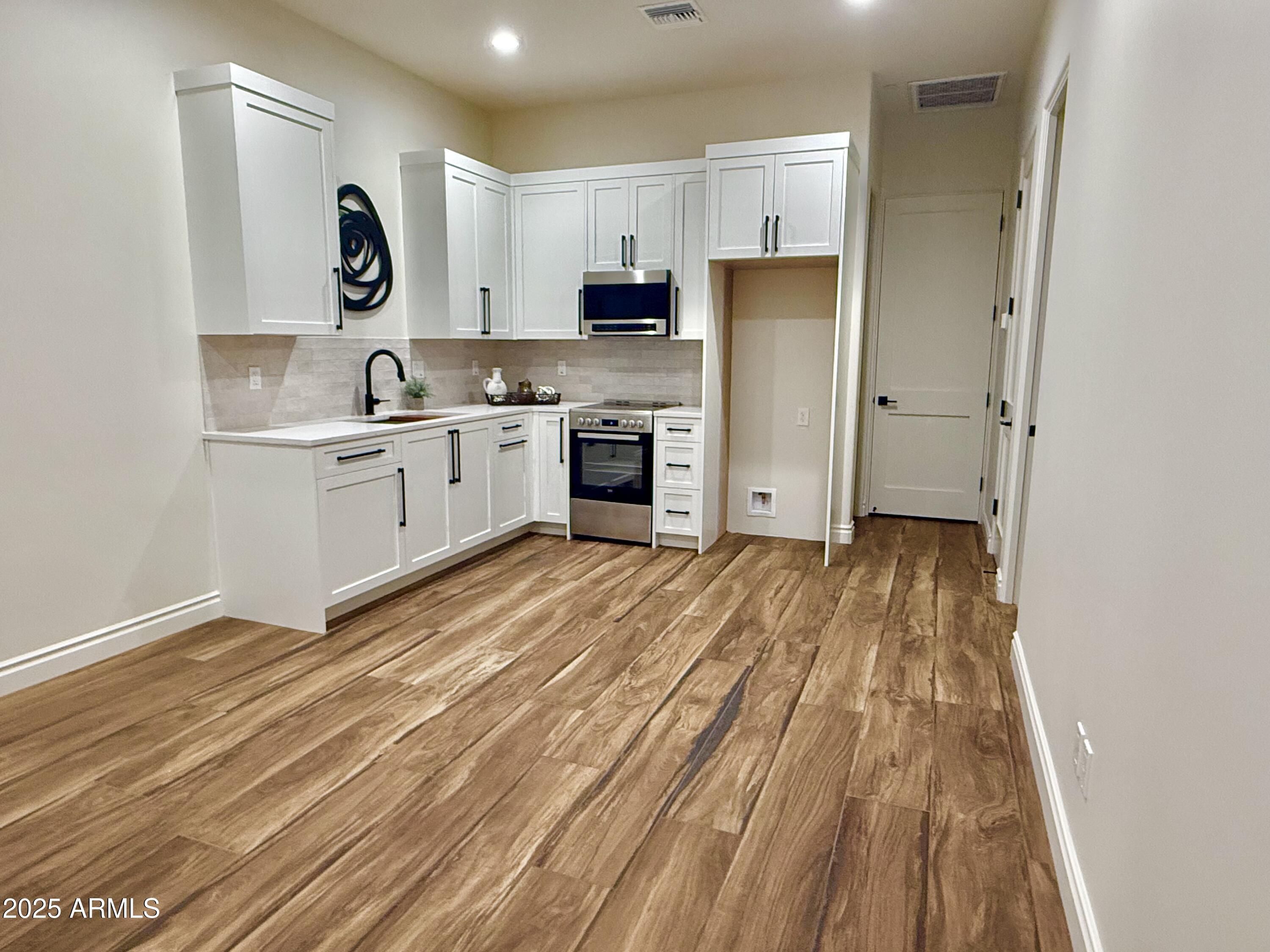 27227 North Miller Road Scottsdale, AZ 85266 - Photo 25 of 31 a kitchen with stainless steel appliances a refrigerator sink and microwave