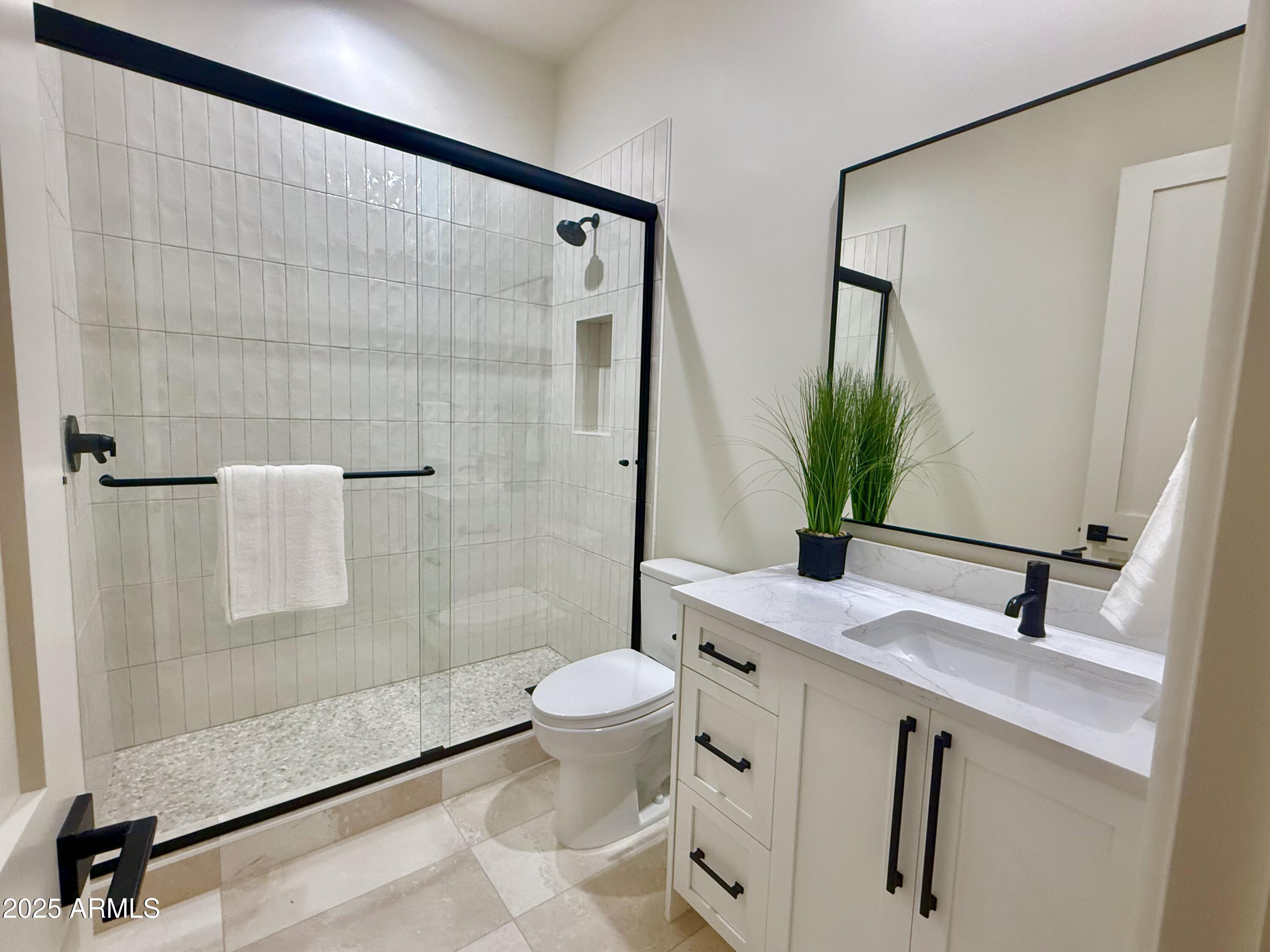 27227 North Miller Road Scottsdale, AZ 85266 - Photo 26 of 31 a bathroom with a sink toilet and shower