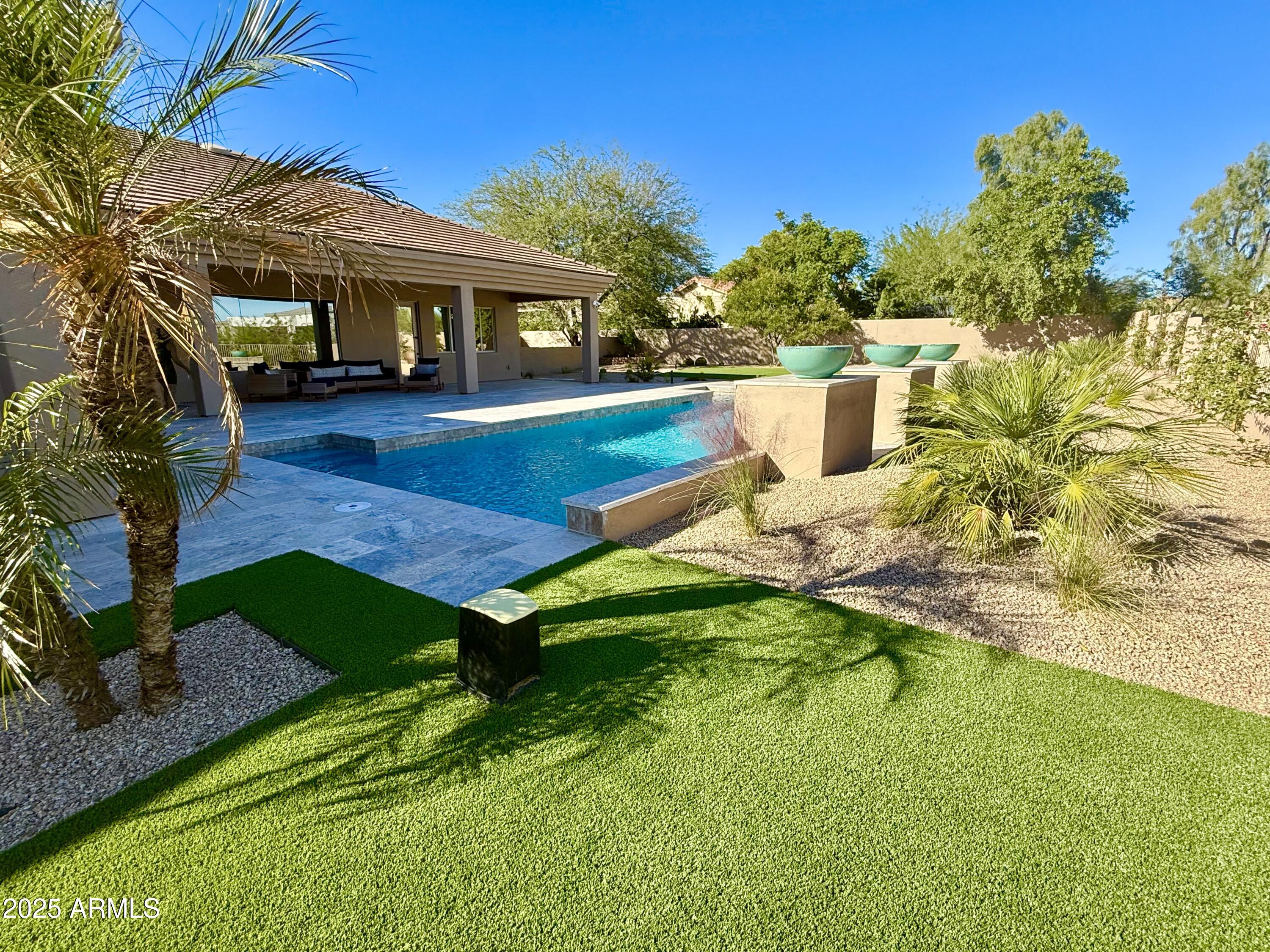 27227 North Miller Road Scottsdale, AZ 85266 - Photo 10 of 31 a view of a house with pool yard and sitting area