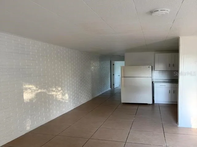 a kitchen with cabinets and stainless steel appliances