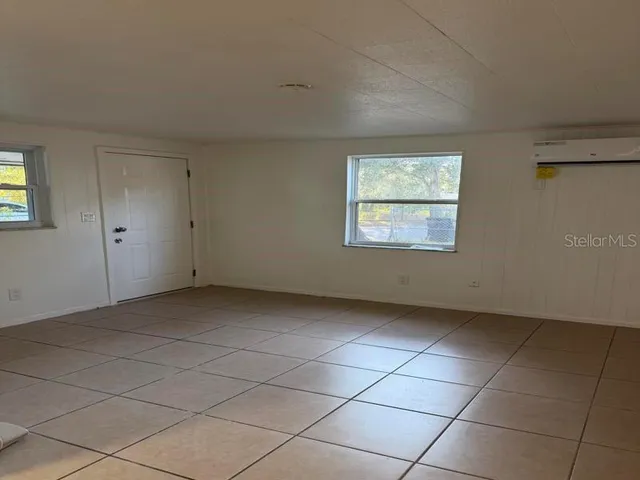 a view of a room that has a window in it