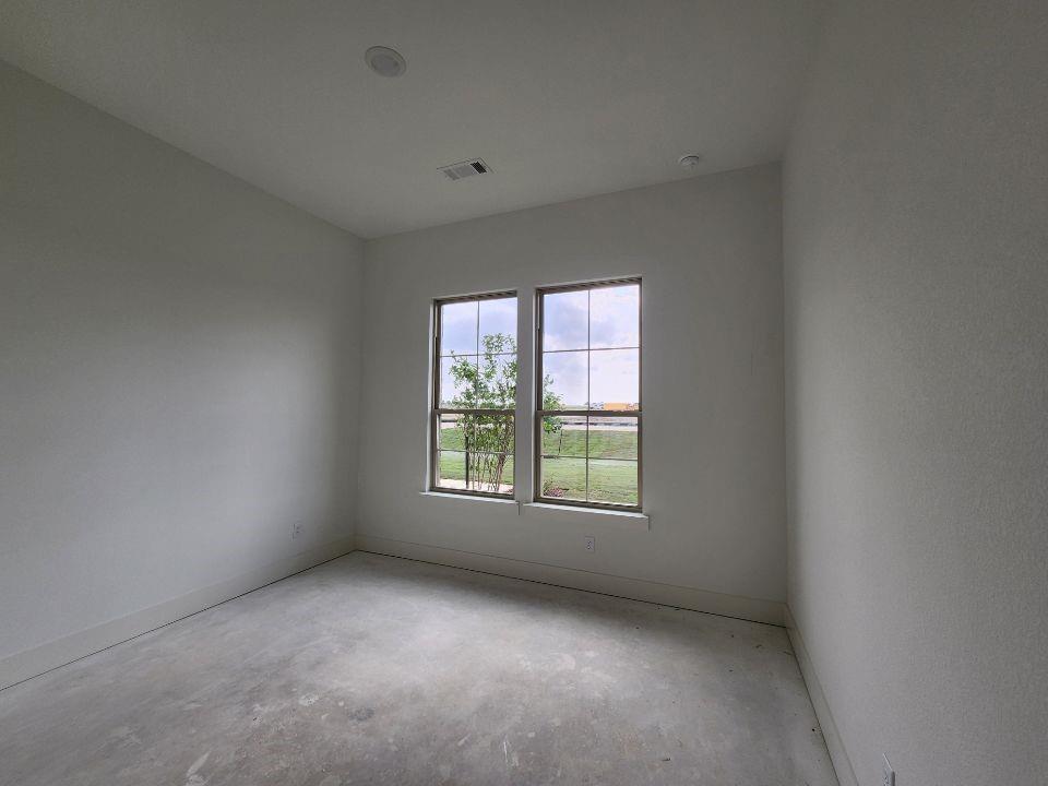 2408 Quartz Street Krum, TX 76249 - Photo 13 of 16 an empty room with a window