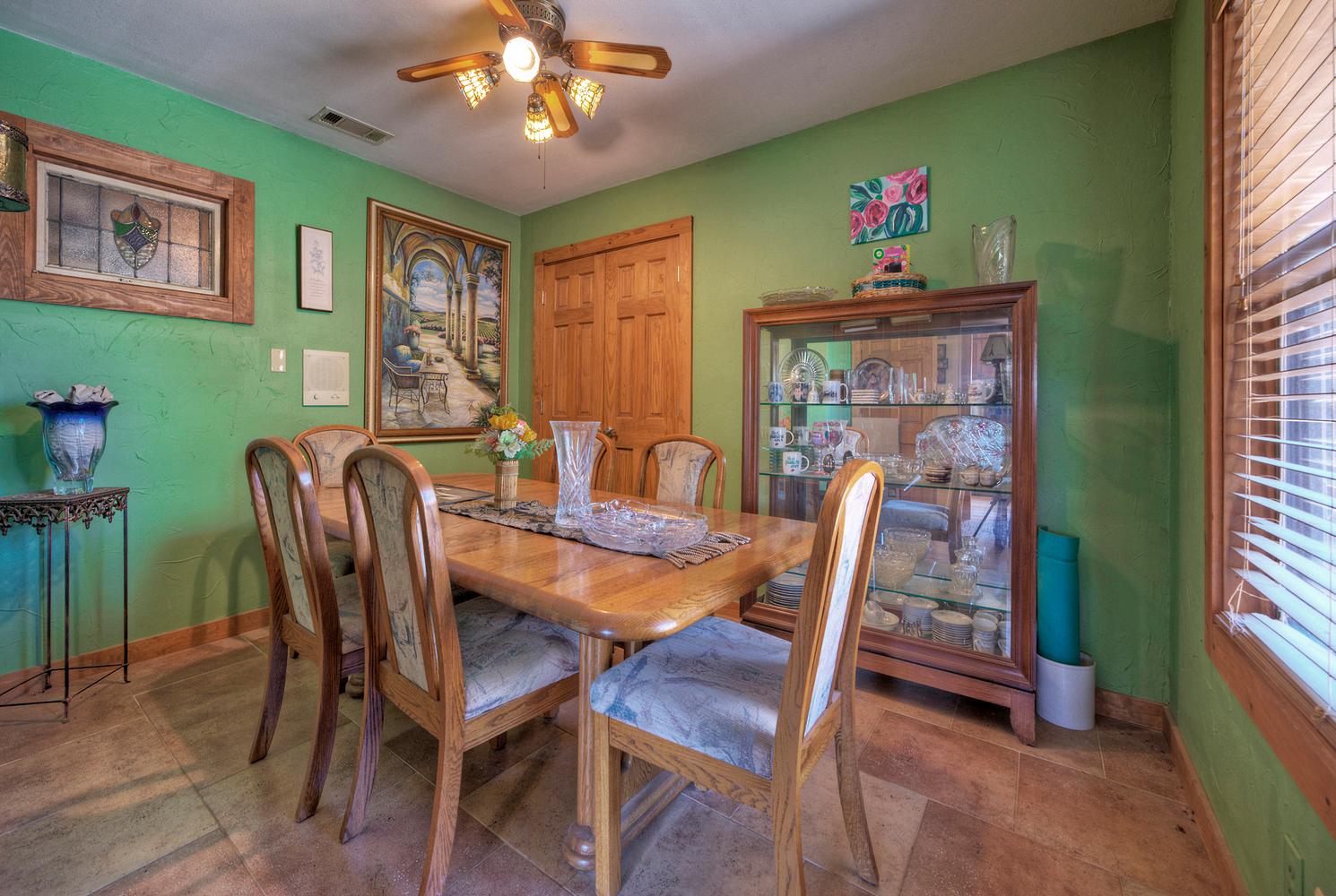 2300 Robin Road Manchaca, TX 78652 - Photo 17 of 36 Richly textured tile floors and classic wood moldings define this inviting dining area.