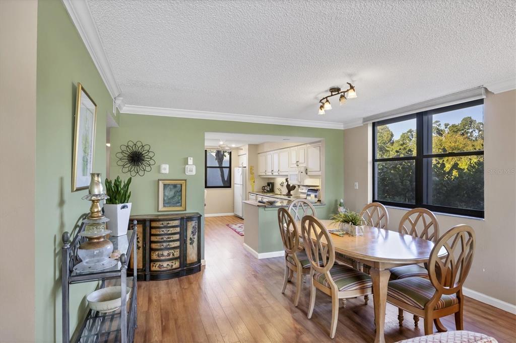 825 Bayport Way, Unit 825 Longboat Key, FL 34228 - Photo 28 of 62 a view of a dining room with furniture window and outside view