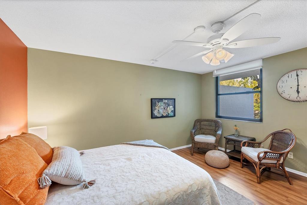 825 Bayport Way, Unit 825 Longboat Key, FL 34228 - Photo 41 of 62 a bedroom with bed and a window