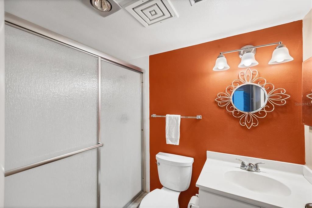 825 Bayport Way, Unit 825 Longboat Key, FL 34228 - Photo 42 of 62 a bathroom with a toilet sink and shower