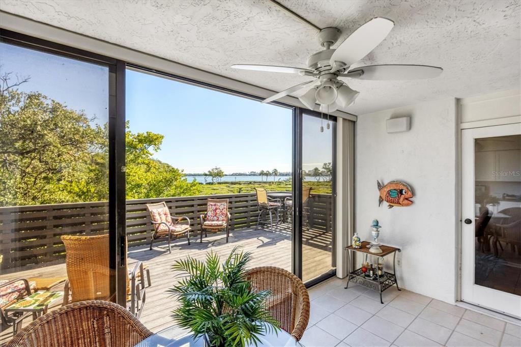 825 Bayport Way, Unit 825 Longboat Key, FL 34228 - Photo 45 of 62 a view of a balcony with furniture