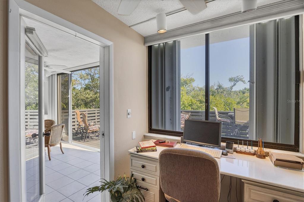 825 Bayport Way, Unit 825 Longboat Key, FL 34228 - Photo 47 of 62 a view of a workspace with furniture and a window